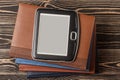 E-book reader close-up on wooden background Royalty Free Stock Photo