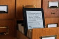 E-book Reader in Library Catalog Card Drawer - New Technology Con Royalty Free Stock Photo