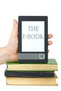 E-book reader on top of classic paper books