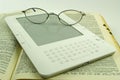 E book spectacles and old paper book Royalty Free Stock Photo