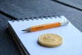 E-Business concept, gold coin and pencil with the inscription Royalty Free Stock Photo