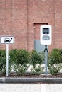 e-car charging station, e-car charge point, electric vehicle supply equipment information sign e-car public charging station Royalty Free Stock Photo