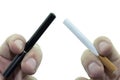 E-cigarette held in fingers vs Cigarette held in fingers Royalty Free Stock Photo