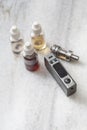 E-cigarettes with lots of different re-fill bottles Royalty Free Stock Photo