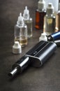 E-cigarettes with lots of different re-fill bottles Royalty Free Stock Photo