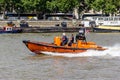 London, UK - 25 July, 2018: E-class Lifeboat of Royal National Lifeboat Institution RNLI sails London River Thames at hight spee