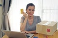Asian beautiful girl buying online from website using credit card for payment. Royalty Free Stock Photo