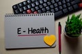 E-Health write on a book isolated on office desk Royalty Free Stock Photo