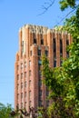 A E Larson building through trees in downtown Yakima Washington with a blue sky