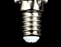 E14 Led bulb base on black background