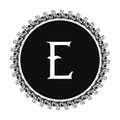 E letter in circle frame in floral ornament style on black color and white background