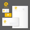 E logo and identity. Electric logo. Yellow logo on business card, letter, envelope. Royalty Free Stock Photo