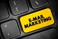 E-mail Marketing - act of sending a commercial message to a group of people, using email, text concept button on keyboard Royalty Free Stock Photo