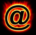 E-mail symbol burning with yellow red flame