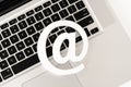 E-mail symbol on a laptop computer keyboard concept for email, communication or contact us