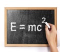 E=mc2 on blank blackboard