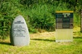 Memorial stone and information board at the entrance to a former prisoner of war camp, Stalag IV B, near Muhlberg in Germany.