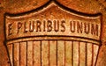 E Pluribus Unum on copper shield. macro photo of the back of a penny