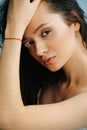 Close up portrait of a stunning woman with serious face and vitiligo eyelashes