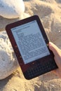 E-Reader being used on Beach Royalty Free Stock Photo