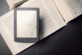 E reader. Digital e book, library reader tablet with books on dark background. Online education course, E learning class Royalty Free Stock Photo