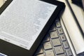 E-Reader Over Laptop Keyboard Royalty Free Stock Photo