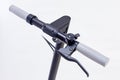 E-scooter handles. Electric folding scooter in dark color. Bell on handlebar of electric scooter. Royalty Free Stock Photo