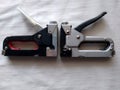 e tool for construction works, 2 stipler black and colors a metaface with metal brackets,