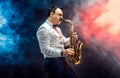 Handsome adult man playing saxophone Royalty Free Stock Photo