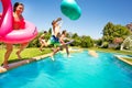 Happy boys and girls playing pool games outdoors Royalty Free Stock Photo