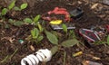 E-waste, WEEE, computer equipment and cell phones batteries lamps scrap components. Soil and water pollution caused by Royalty Free Stock Photo