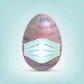 Easter Egg in surgical mask. Colourful 3D egg in protective medical mask vector isolated on blue background. Stop virus COVID-19 Royalty Free Stock Photo