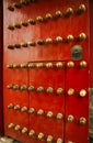 Richly decorated red wooden door with decoration in the Forbidden City, Beijing, China. Royalty Free Stock Photo