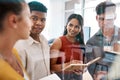 They each have such brilliant ideas to share. a group of businesspeople brainstorming together in an office. Royalty Free Stock Photo