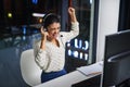 Each problem solved is a personal victory. an attractive young woman cheering while working in a call center. Royalty Free Stock Photo