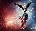 Eagle With American Flag Flies In The Fireworks Royalty Free Stock Photo