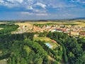 Eagle-eye shot of a town, trees, and agricultural fields - perfect for background