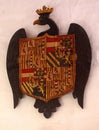 Eagle holding coat of arms