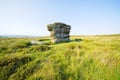 The Eagle Stone gritstone outcrop standing tall in the sunshine Royalty Free Stock Photo