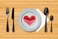 ealistic plate with spoon, knife and fork and heart on a wooden background. Cutlery on a wood table Royalty Free Stock Photo