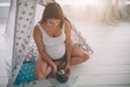 Ealthy Pregnant woman eating fruit in the children`s room in the children`s room. Royalty Free Stock Photo