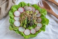 Ealthy spring salad with asparagus on a table