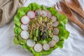 Ealthy spring salad with asparagus on a table