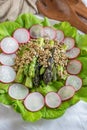 Ealthy spring salad with asparagus on a table