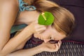 Ear candling being carried out on an attractive caucasian woman in a spa Royalty Free Stock Photo