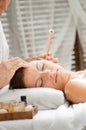 Ear Candling in Spa Royalty Free Stock Photo