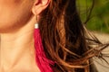 Ear of a happy woman with a beautiful earring