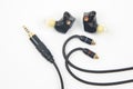 In-ear headphones for Hi-Fi music player. Audio sound and modern equipment for music lovers and audiophiles Royalty Free Stock Photo