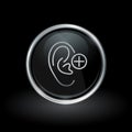 Ear hearing icon inside round silver and black emblem