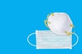 Ear-loop face mask 3 ply, Safety N95 masks on blue background. dust protection respirator and breathing medical respiratory mask